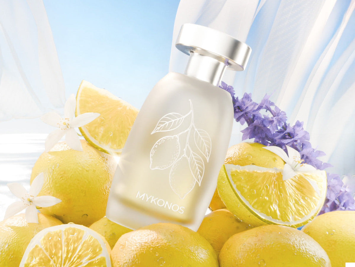 Mykonos Slow Living perfume bottle among Amalfi lemons and lavender in Mediterranean light